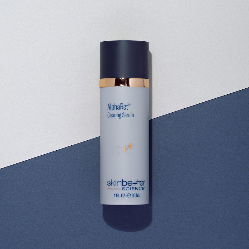 skinbetter Alpharet Clearing Serum on dual tone blue background